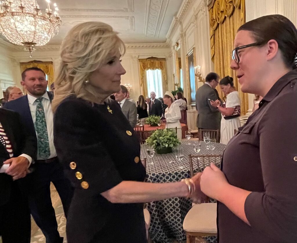 HunterSeven Foundation Executive Director and Clinical Nurse Researcher, Chelsey Simoni speaks with First Lady, Dr. Jill Biden at the White House Memorial Day Breakfast on May 30th 2022 about prevention-based screening in Post-9/11 veterans.